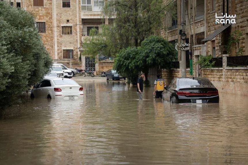 Syrians confront unexpected summer rains