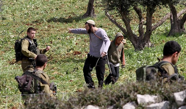 Three Palestinians hurt in settlement attack