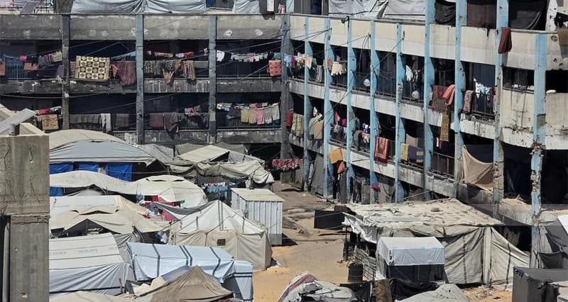 فلسطينية وشهيدها في غارة جديدة