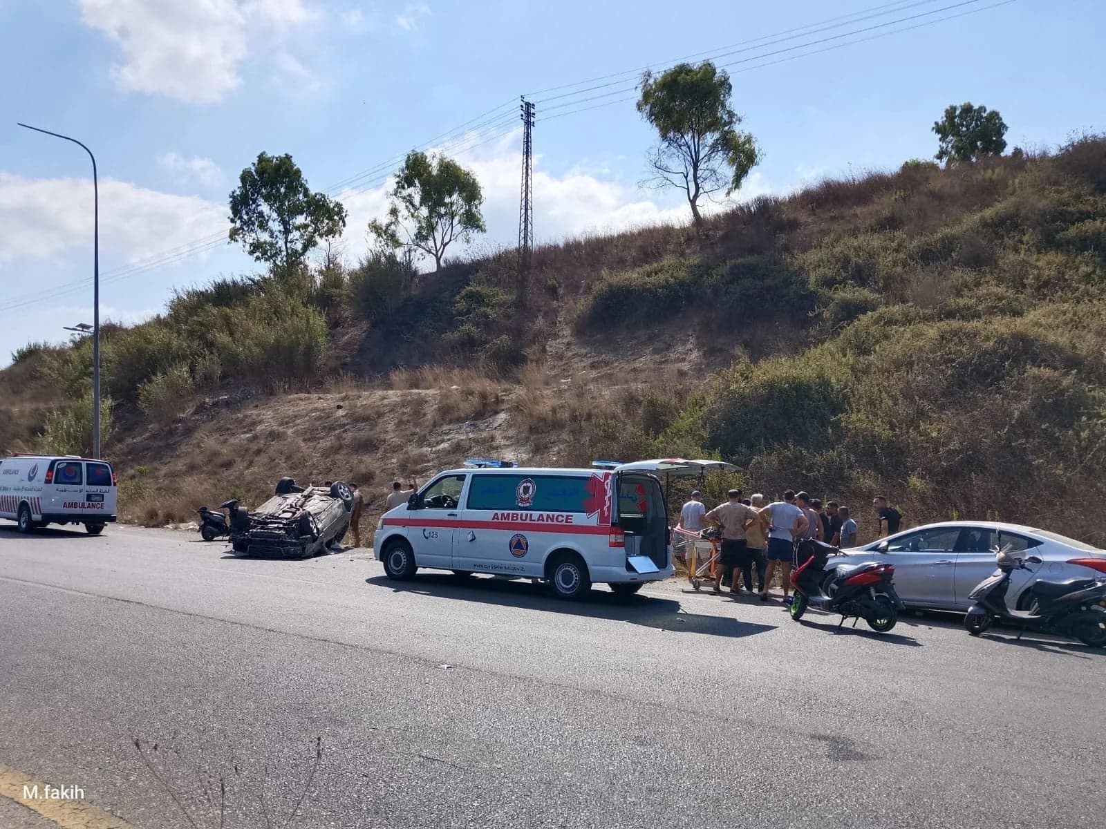 Car falls from mountainside onto highway