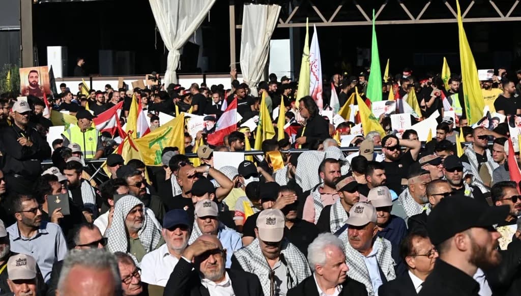 Murshed Suleiman's Presence at Nasrallah Event Raises Legal Questions