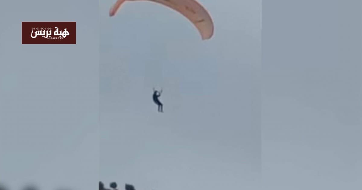 Ceuta migrant parachutes over border