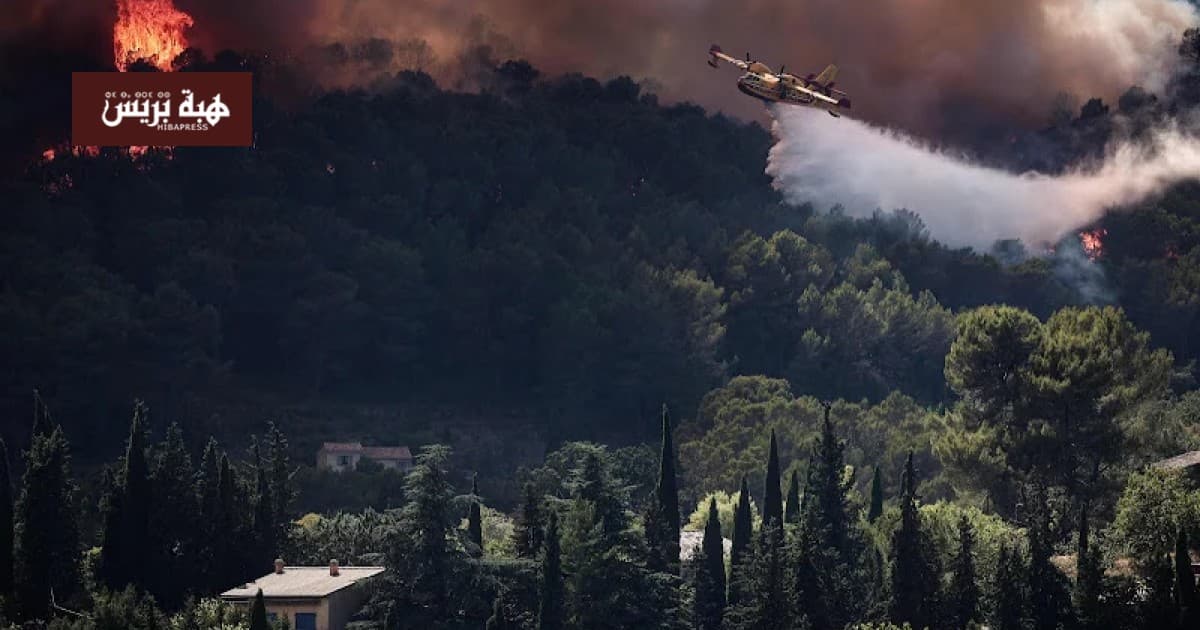 France conducts mass evacuation as flames near resort