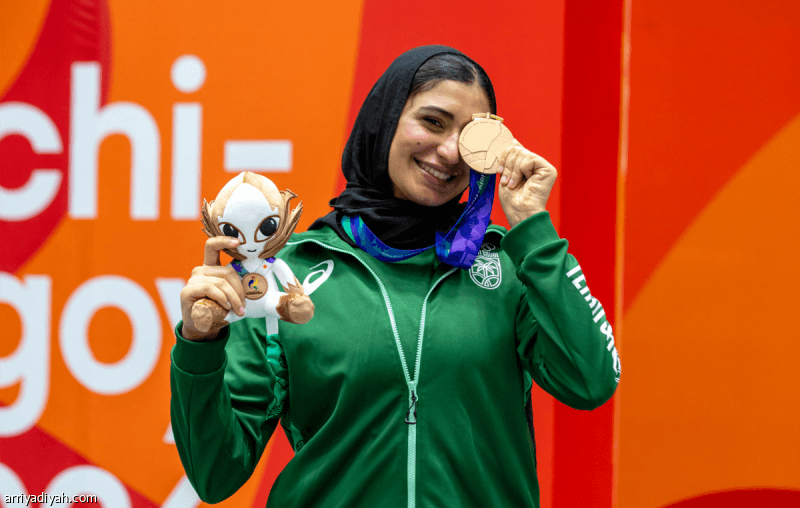 Dina earns first women's medal at Asian Games