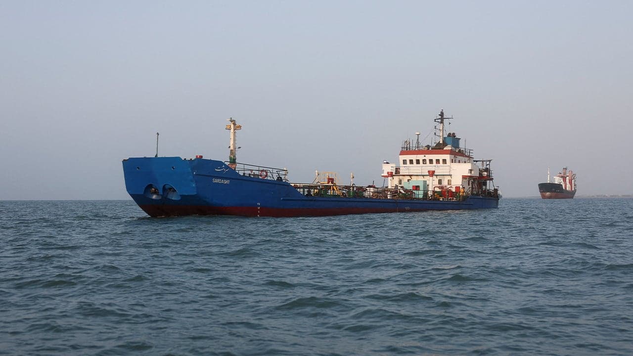 Iran Strikes Commercial Ship in Strait as US Deploys Warship