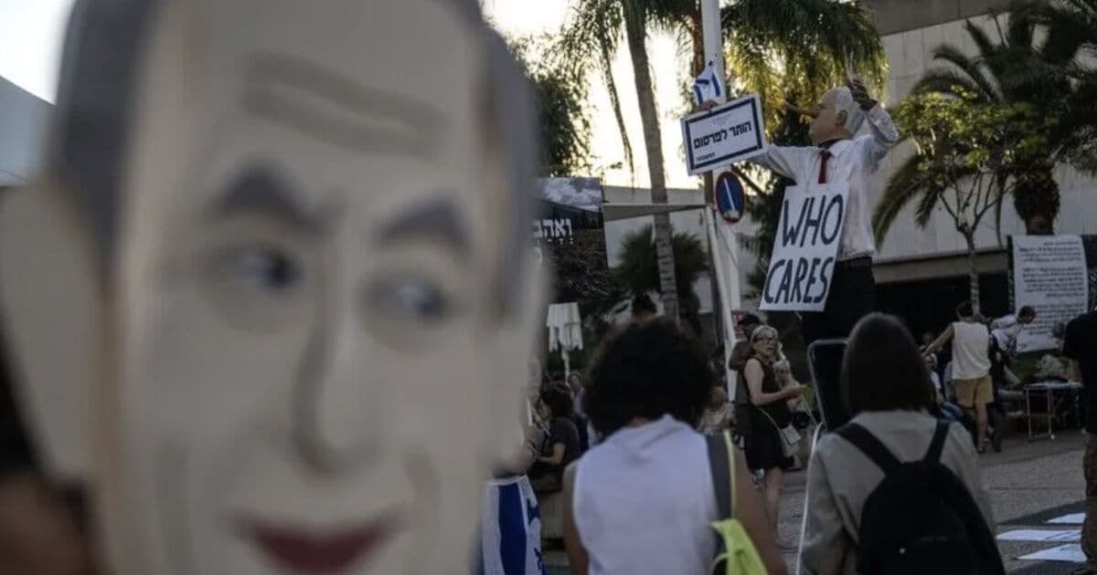 Protests in Israel over Netanyahu as Barak warns of war
