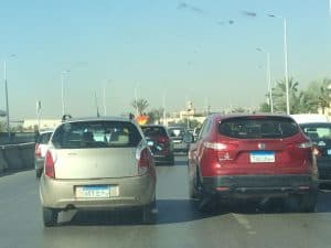 Morning traffic in Cairo and Giza with security present