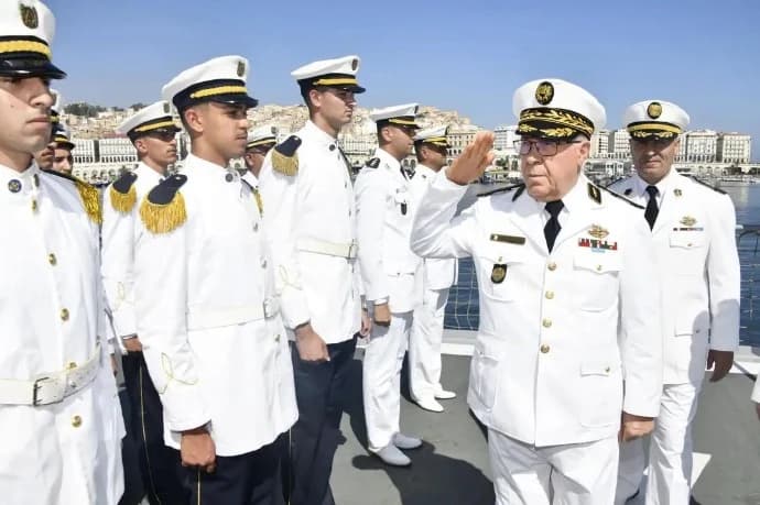 Navy Commander reviews post-training inspection