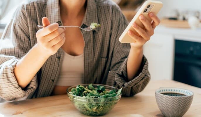Why do we eat hastily when distracted