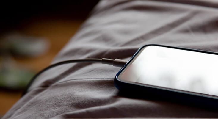 Experts Warn Against Charging Your Phone Next to Your Pillow Due to Safety Risks