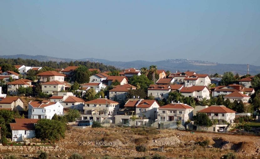 Britain to ban settlement goods and expand sanctions