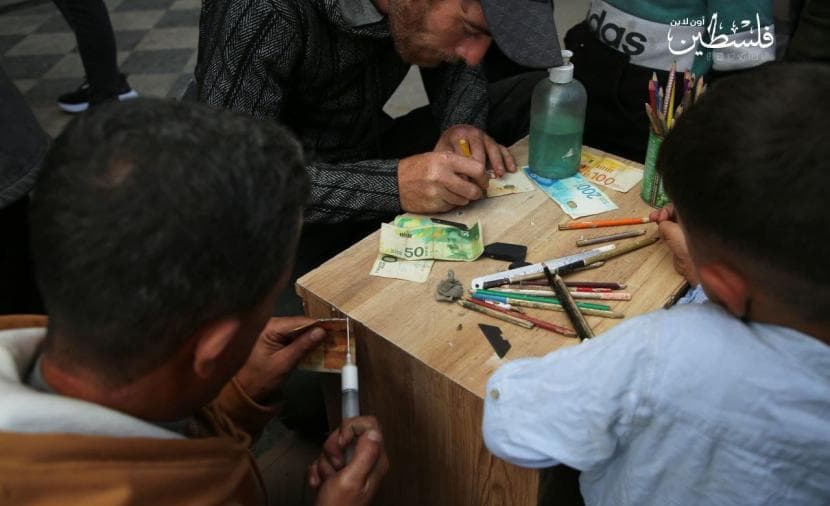 Gaza's move to electronic payments burdens citizens