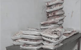Kom Hamada checks expired frozen meat
