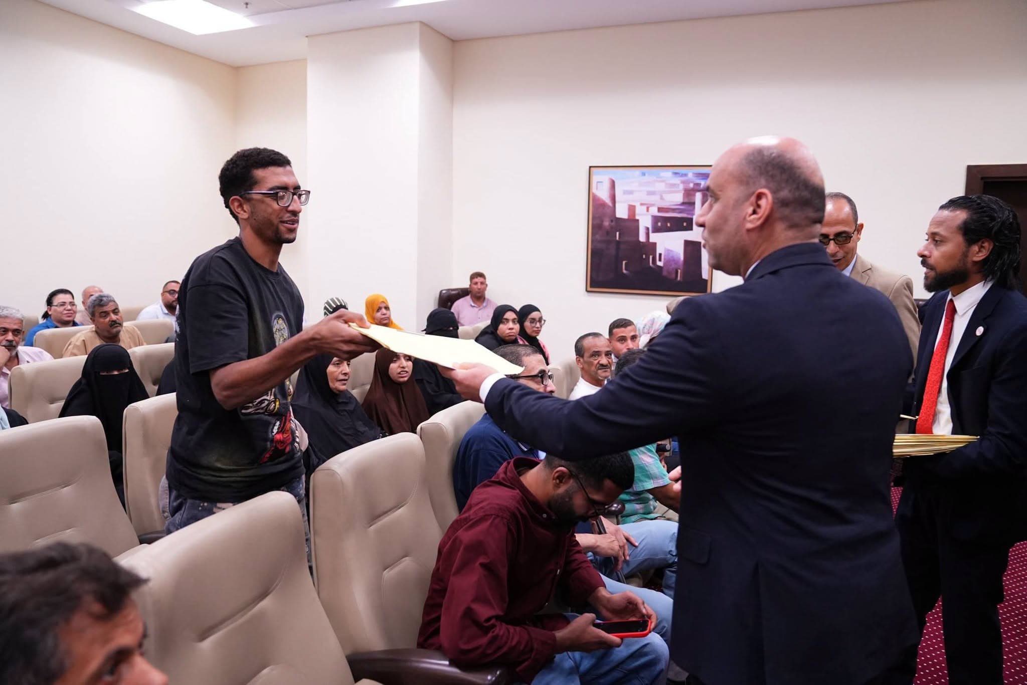 Labor Minister distributes contracts to persons with disabilities