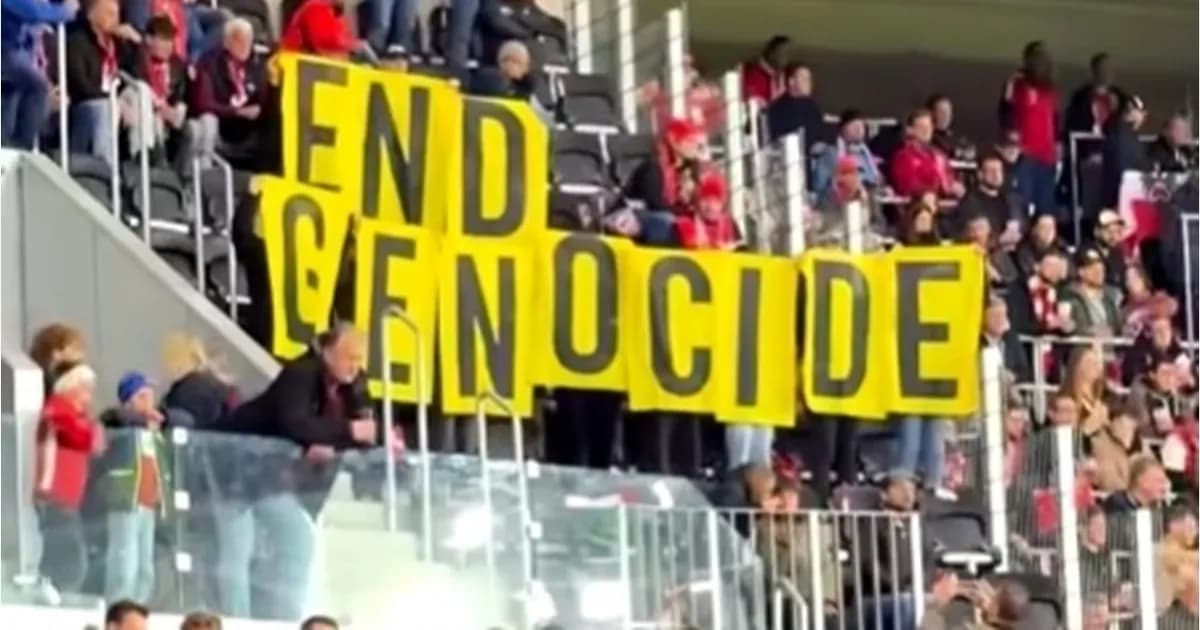 Sign calling to end genocide during Austria vs. Occupation match