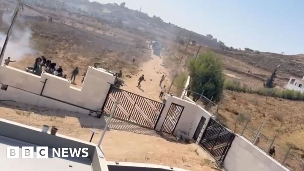 Israeli settlers surround Palestinian families