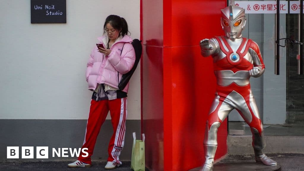 Young Chinese students admire a professor easing their anxiety