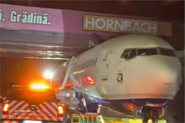 Passenger plane trapped under Bucharest bridge