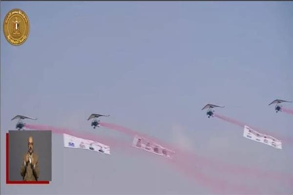 Planes with martyr images salute in front of Sisi