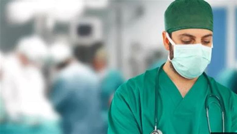 Reason for surgeons' green attire in surgery