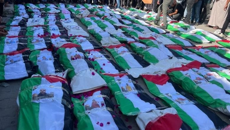تشييع جنازة 100 شهيد من غزة