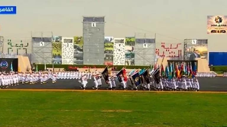 Police students display batch numbers at graduation