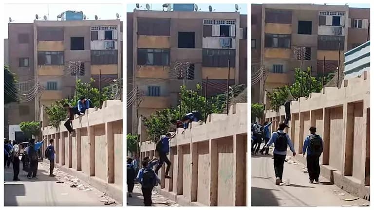 طلاب يفرون بحقيبة من فوق السور