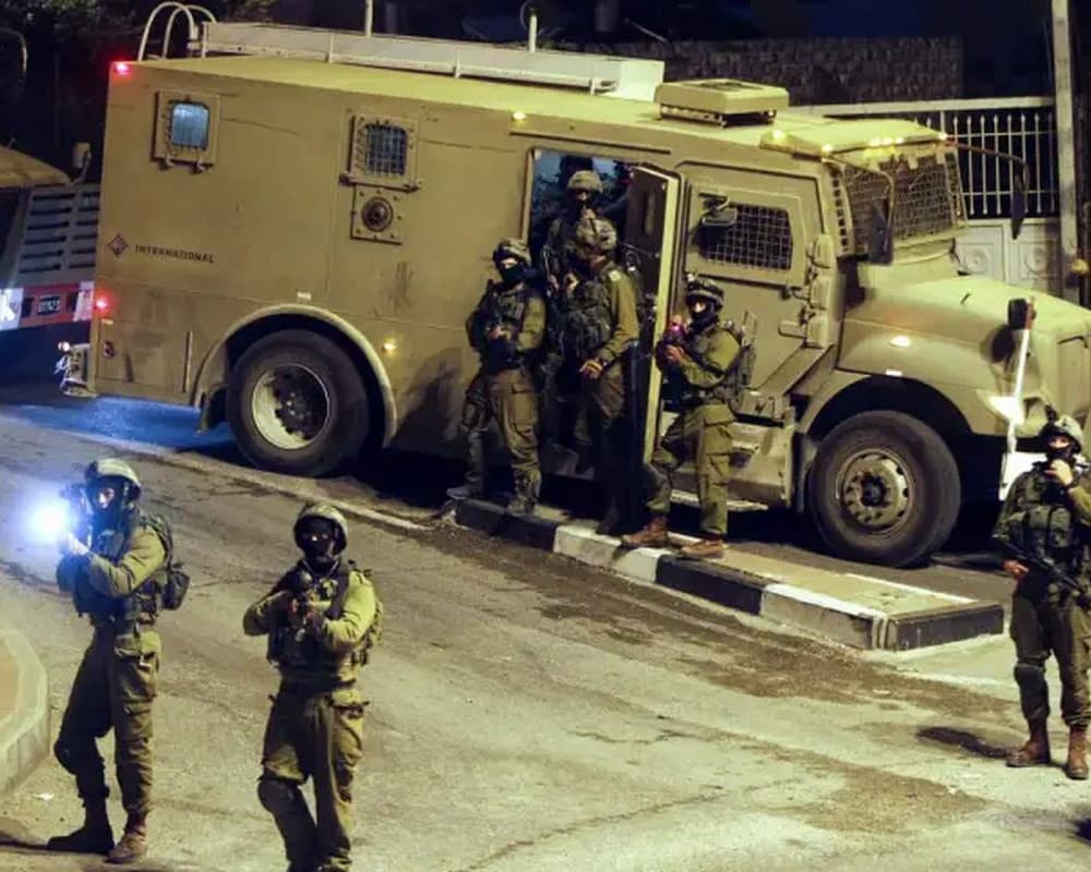 Occupation forces deface homes with racist slogans