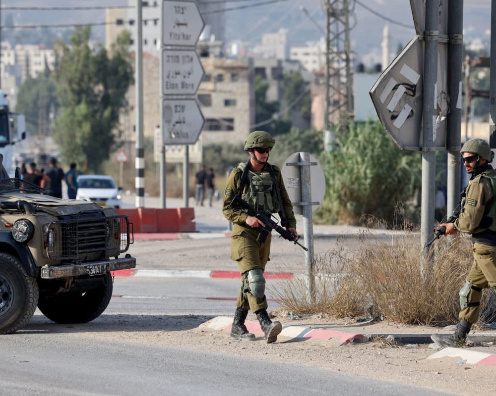 Israeli army warns to protect West Bank settlements