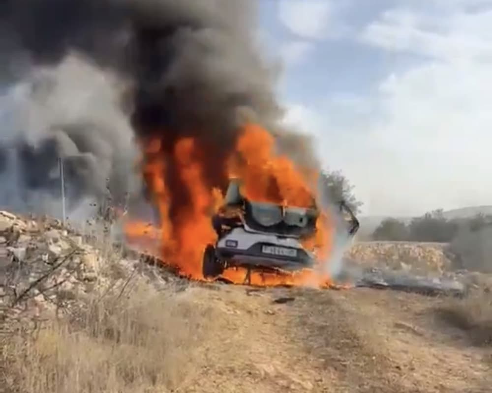 Settlers attack olive harvesters and set vehicles ablaze