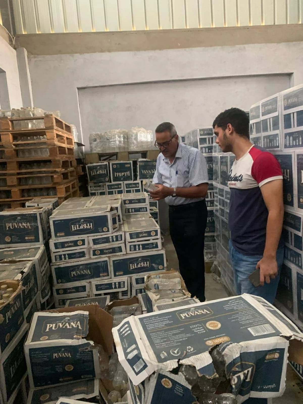 Seizure of 17,000 water bottles and 4 tons of unverified ghee in Al-Sharqiya