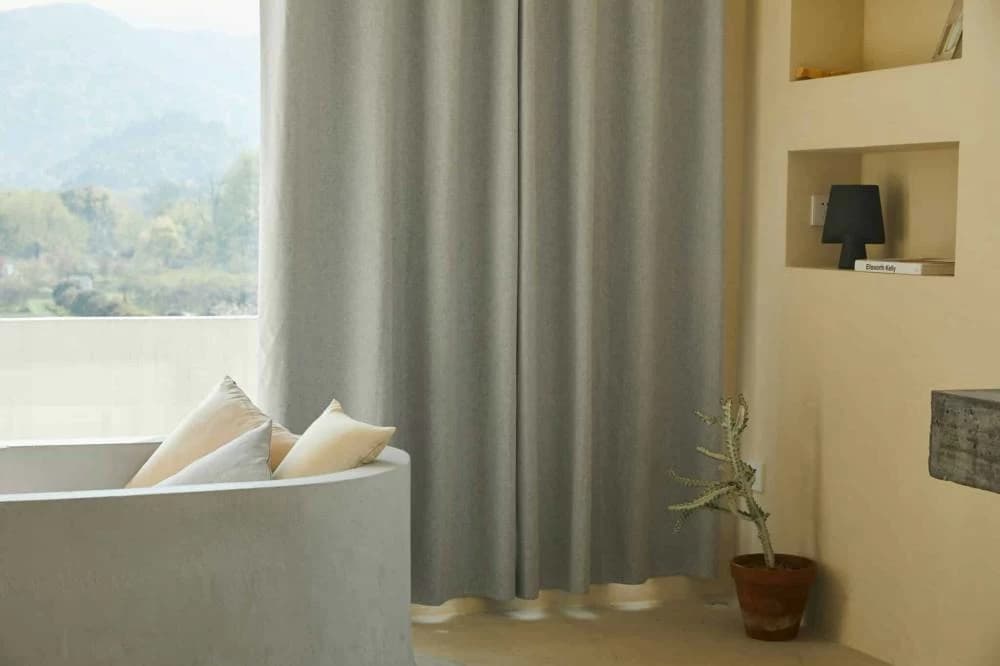 Incorrect placement near curtain risks heat buildup