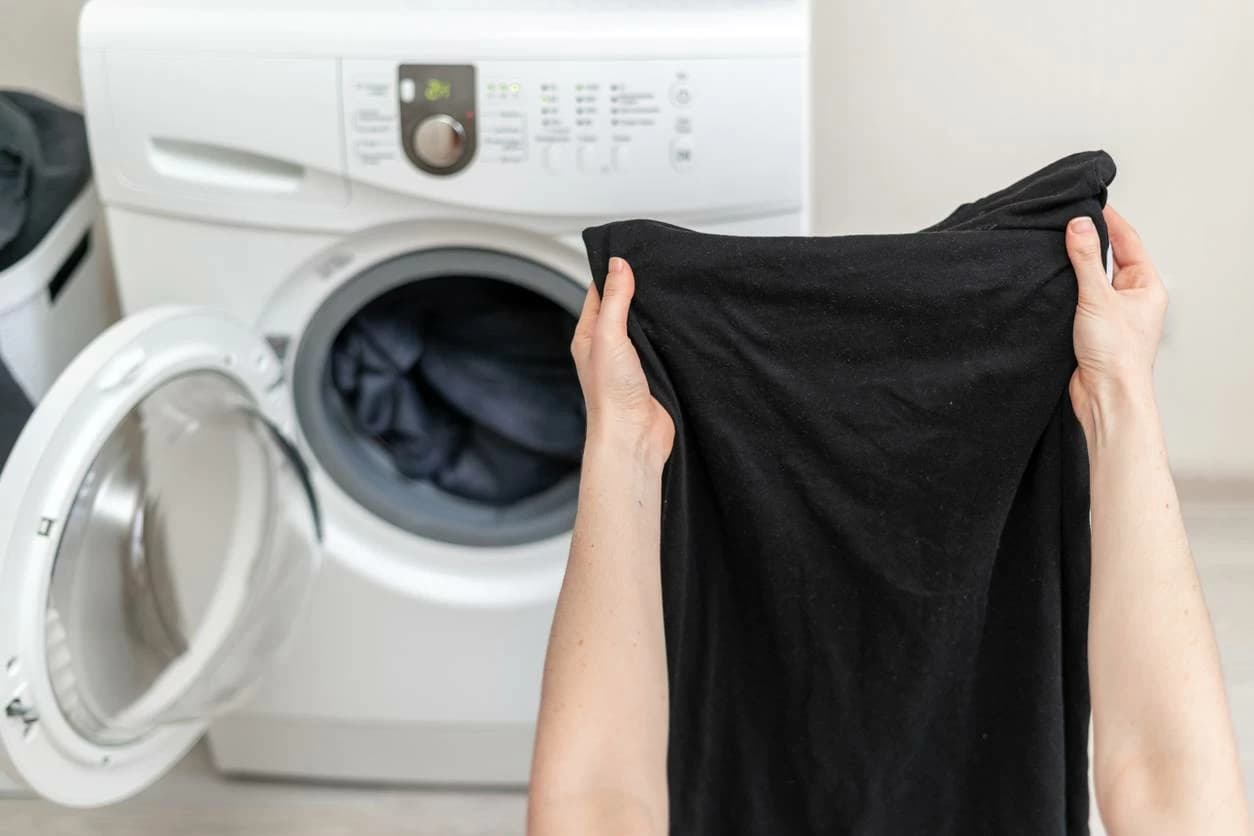 Black clothes with white spots causes
