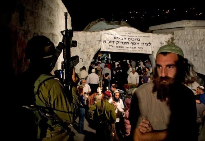 Settlers storm Joseph's Tomb under forces in Nablus