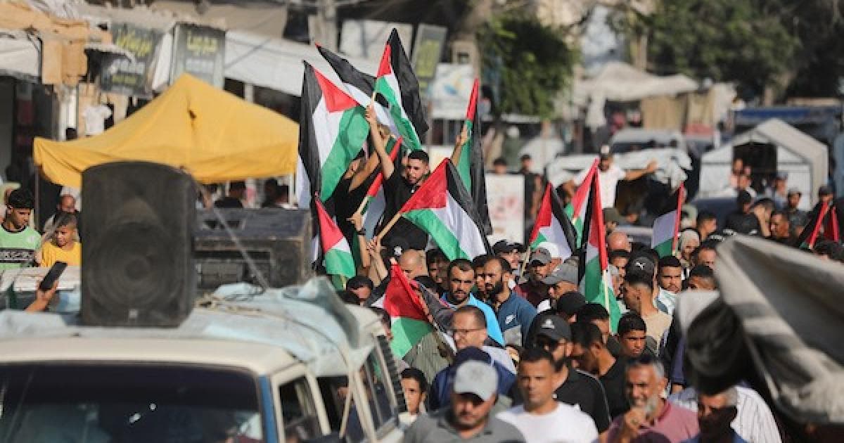 Palestinians march in Gaza to mark 1000 days of conflict