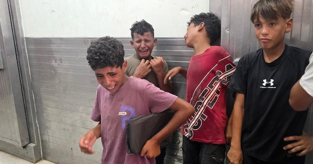Palestinians mourn child Suhail Abu Shalouf in Gaza morgue after Israeli airstrike