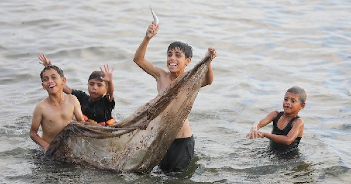 Palestinian Families Seek Relief at Gaza Beach