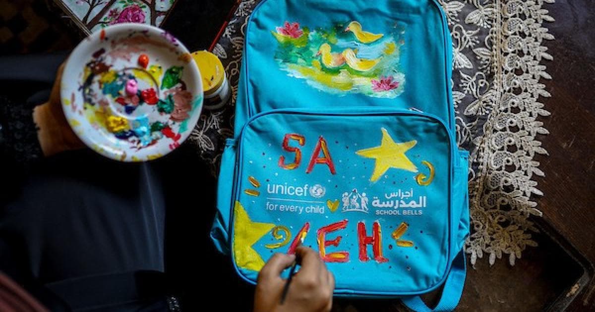 Colors on Gaza's bags as young artist brings joy to school start