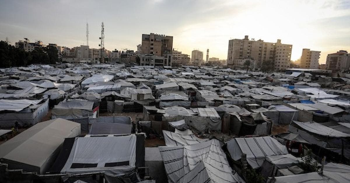Photos of tents sheltering Palestinian displaced amid destruction