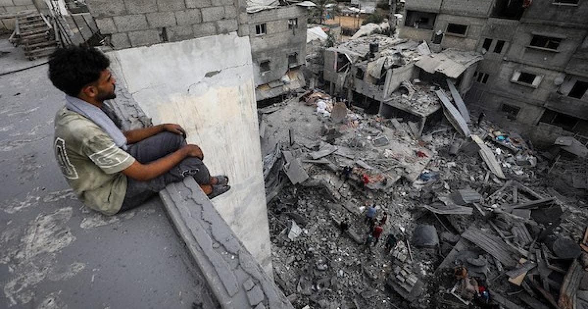 Palestinians examine belongings after raid