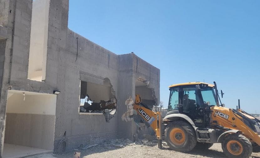 Occupation forces compel Tamra resident to demolish house