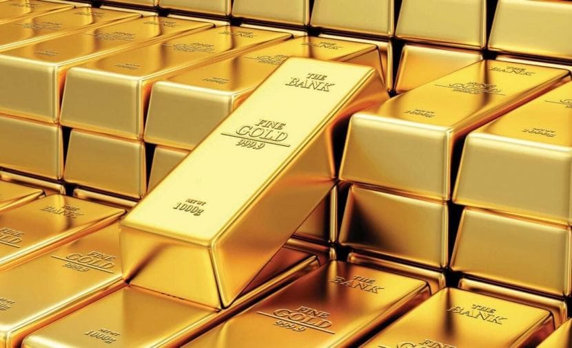 Gold falls as dollar rises, monthly gain max since February