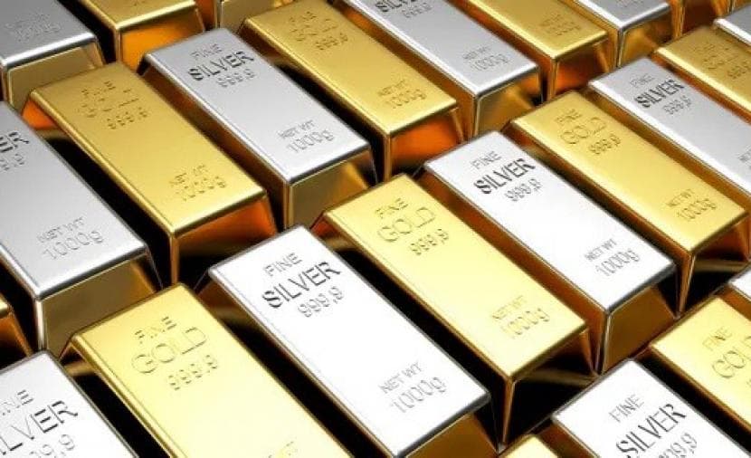 Gold low as silver slides