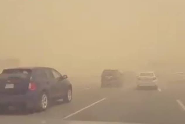 Dust reduces visibility on desert road