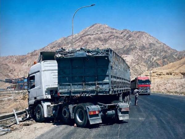 Truck blocks lane on Aqaba back road