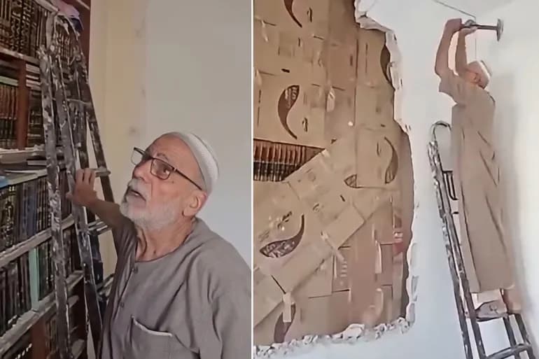 مسن سوري يزيل جدارا لحماية مكتبة ابنه