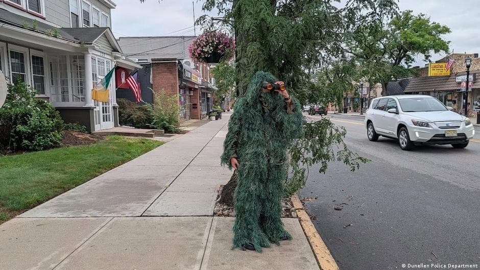 Police officer in tree costume targets phone users