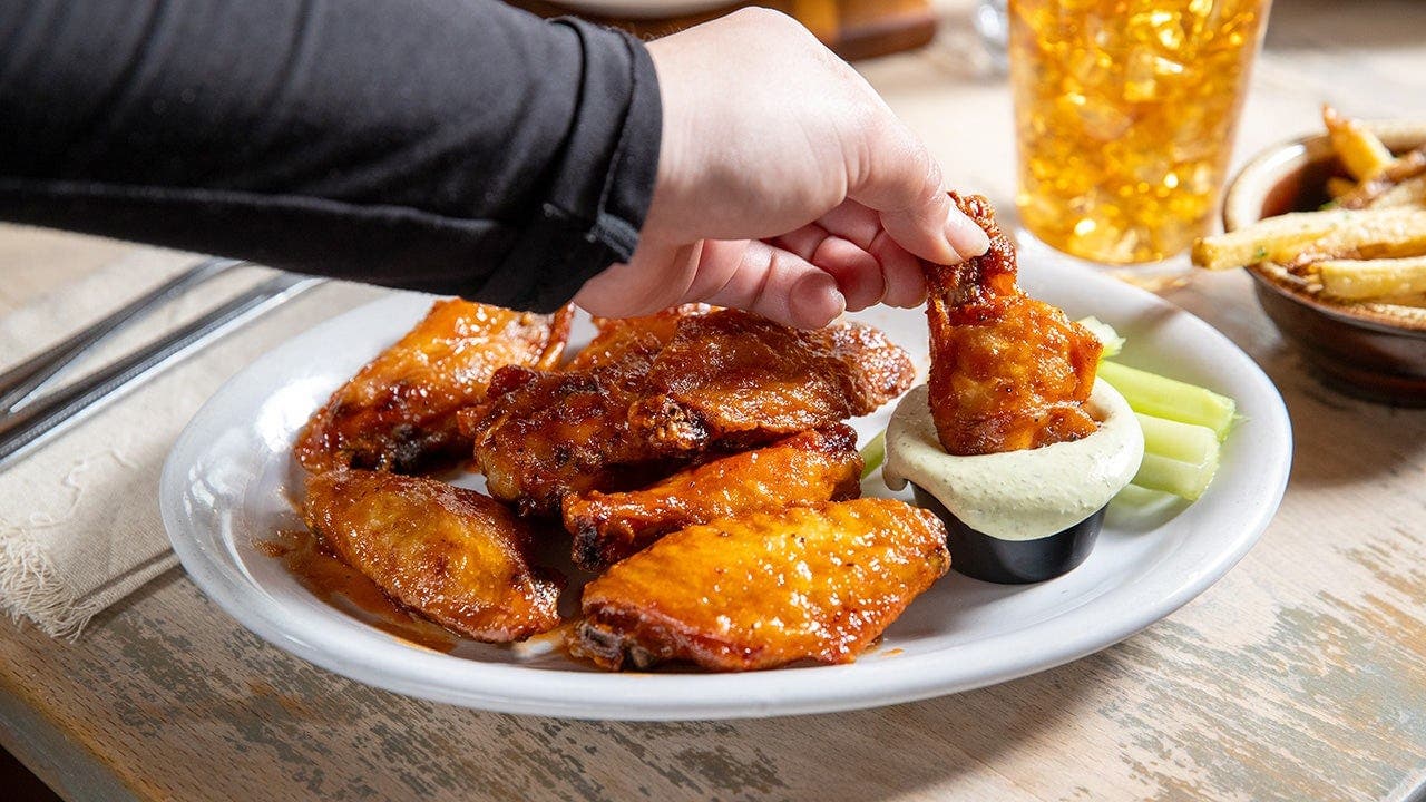 Chicken wing costs fall but prices may stay