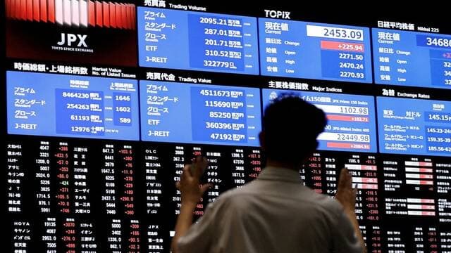 Asian stocks fall as tariffs kick in