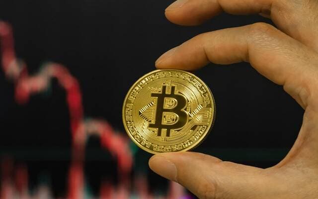 Bitcoin dips below $63,000 as law delay